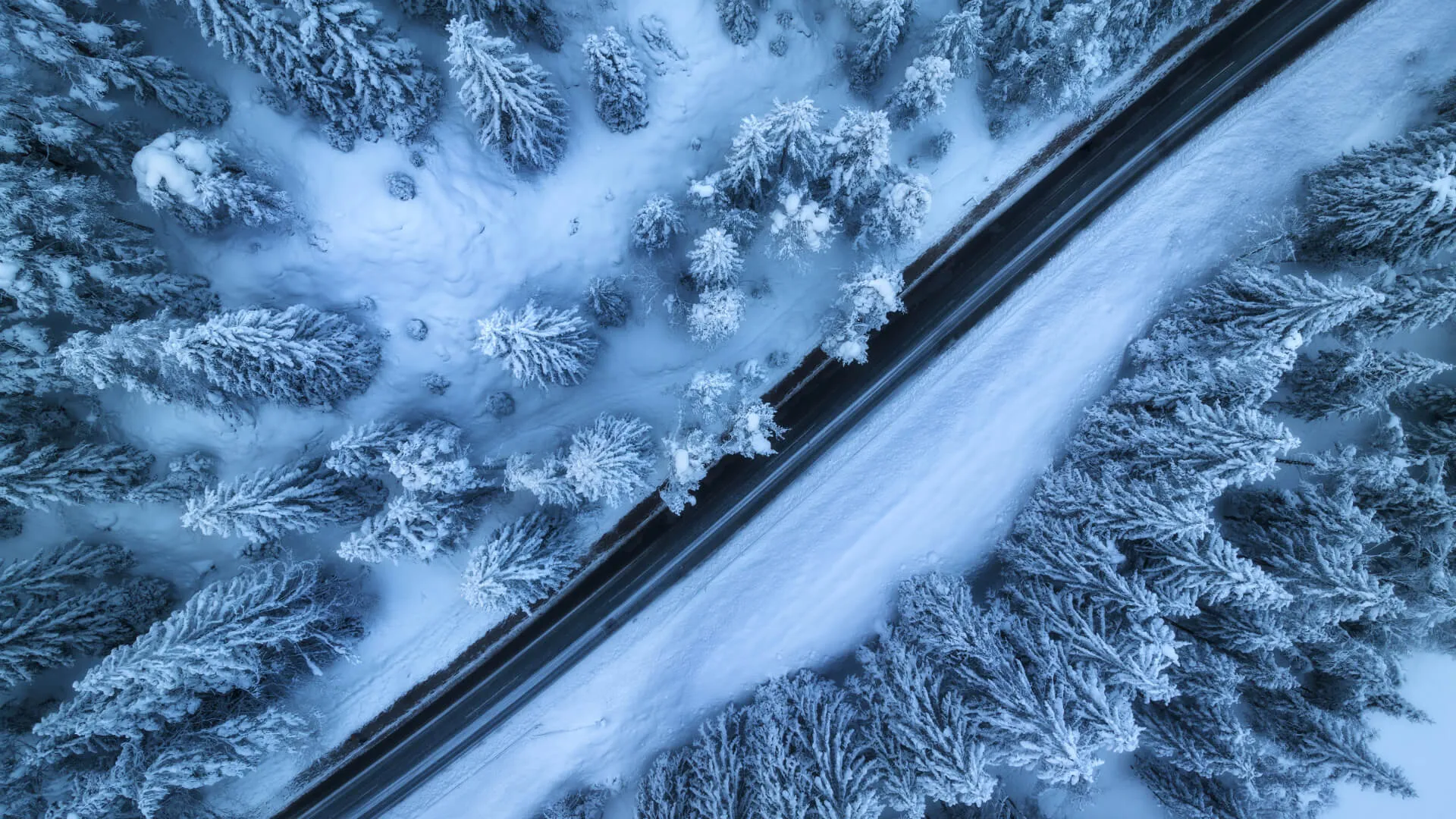 Road which has been de-iced using road salt within snowy conditions